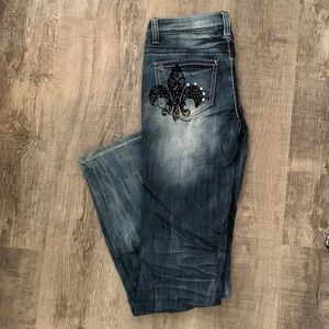 Petrol jeans. Boot cut. Embellished pockets.